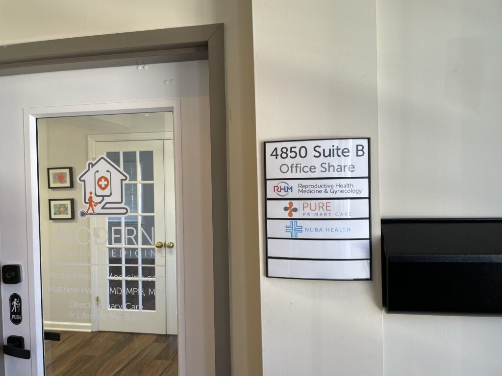 Suite entrance and tenant list for shared space at 4850 31st St S, Suite B